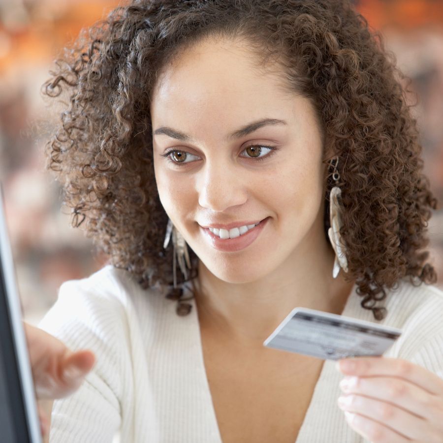 woman paying with her card