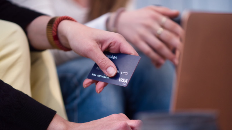 Woman paying using card