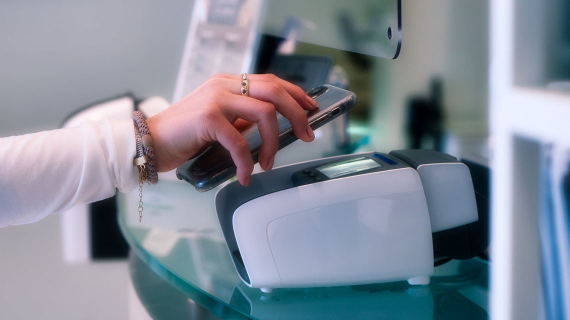 Woman paying with mobile